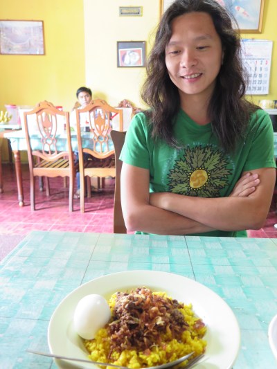 Chriswan communing with his favourite nasi kuning. 